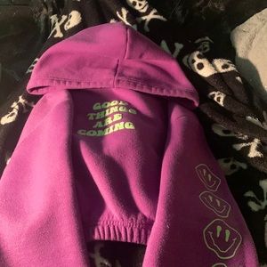 Purple cropped hoodie with smiley faces down the sleeves